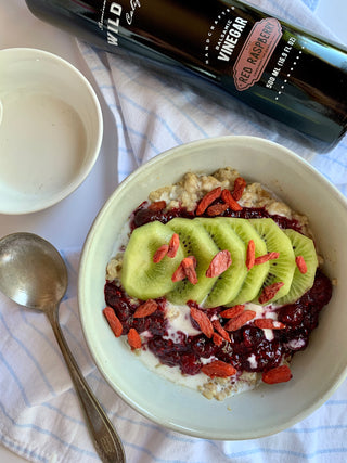 Creamy Coconut 3-Grain Porridge with Mixed Berry Coulis